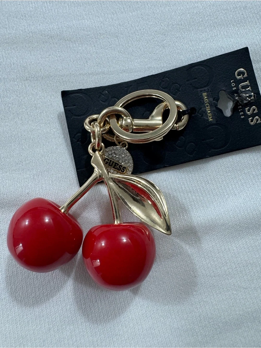 GUESS Cherry Bag Charm and Keychain in Gold Tone